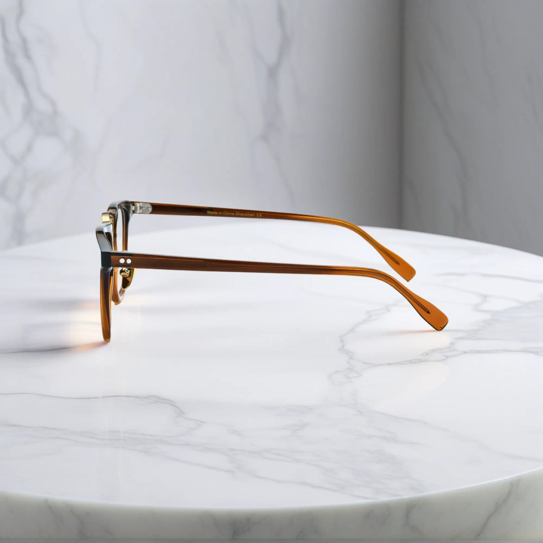 Side profile of VoyueLens™ VL19214 brown square eyeglasses highlighting slim temples and embedded metal hinge construction.