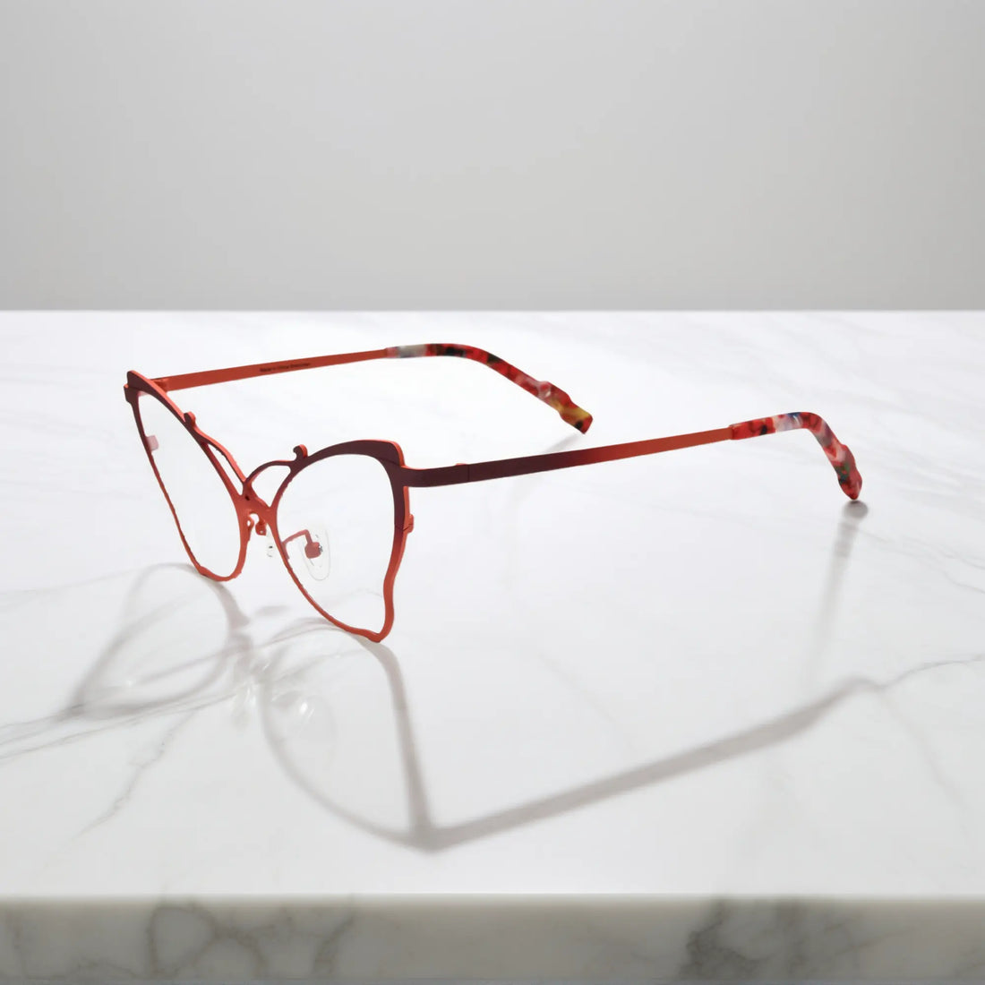 Side of VoyueLens™ VL185862 titanium butterfly eyeglasses in Amber Orange – a lightweight, colorful, vintage-inspired, prescription ready frame designed for unique artistic style and everyday comfort.