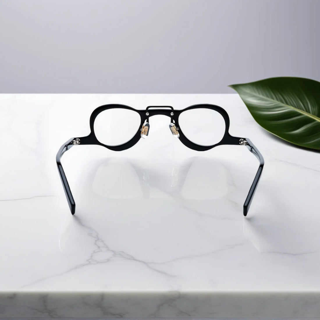 Back view showing the nano-polished black acetate frame of VoyueLens eyeglasses with ergonomic silicone nose pads.