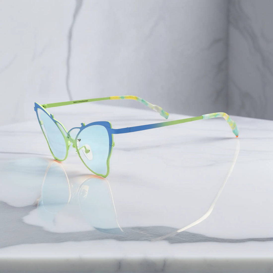 Side of VoyueLens™ VL185862 titanium butterfly eyeglasses in Blue Green – a lightweight, colorful, vintage-inspired, prescription ready frame designed for unique artistic style and everyday comfort.