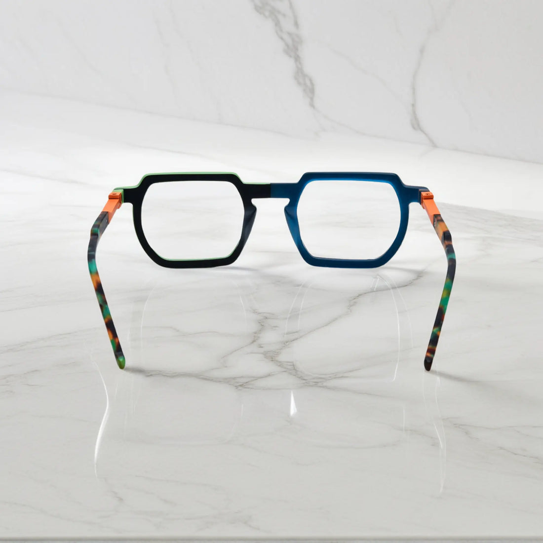 Rear view of bold Blue-Green Matte acetate frames with spring hinges and smooth finish