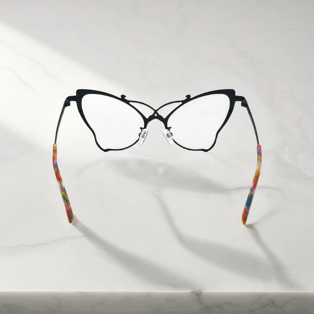 Back of VoyueLens™ VL185862 titanium butterfly eyeglasses in Charcoal Black – a lightweight, colorful, vintage-inspired, prescription ready frame designed for unique artistic style and everyday comfort.