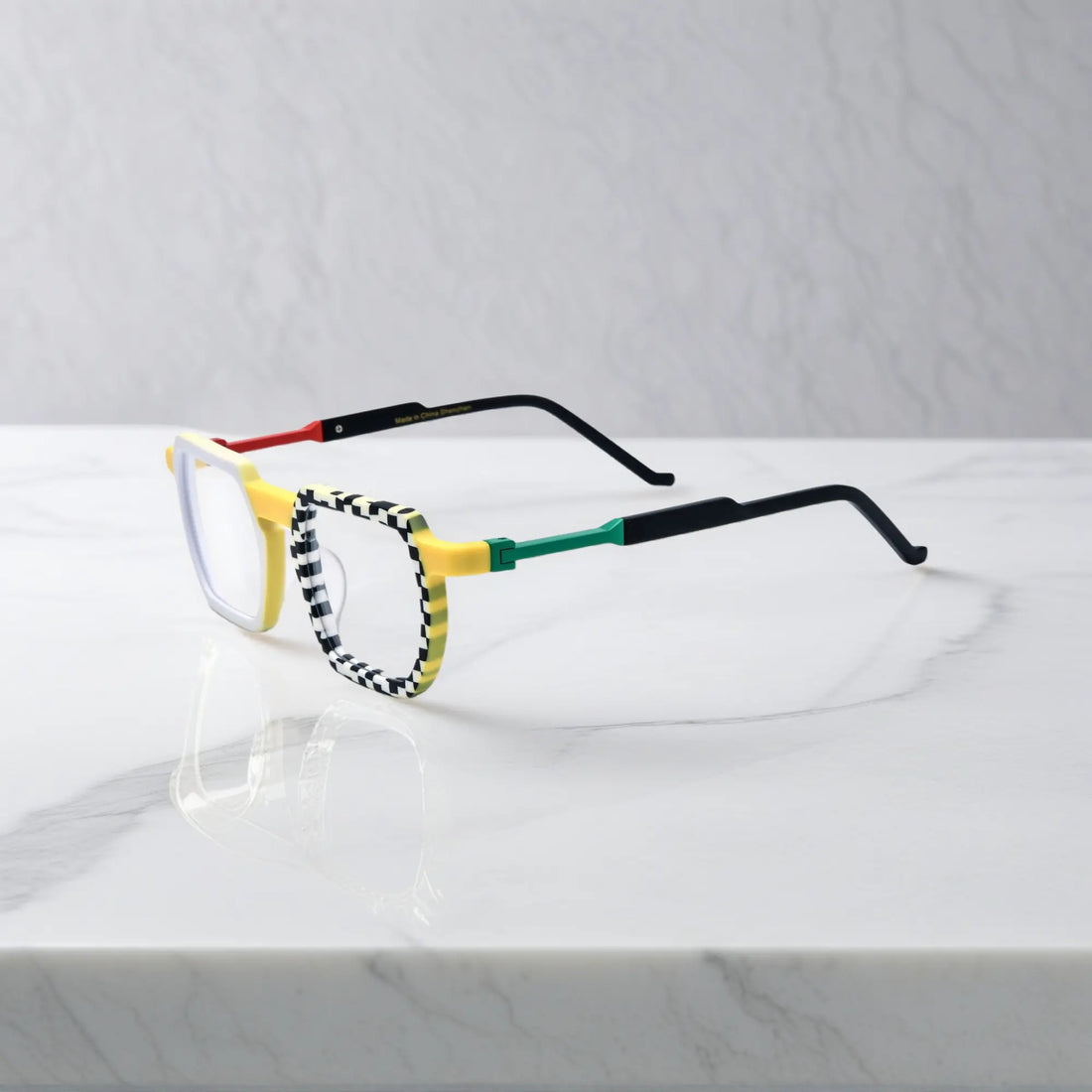 Side view highlighting yellow-black checker pattern on acetate arms with edgy streetwear flair