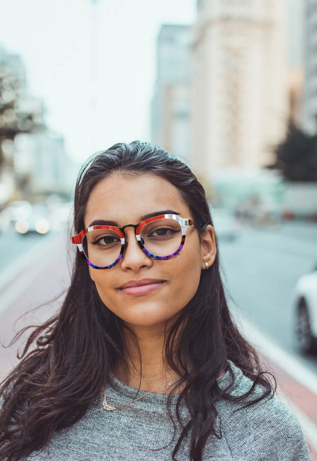 Model wearing VoyueLens Crimson Fade on Walnut red grey acetate aviator eyeglasses
