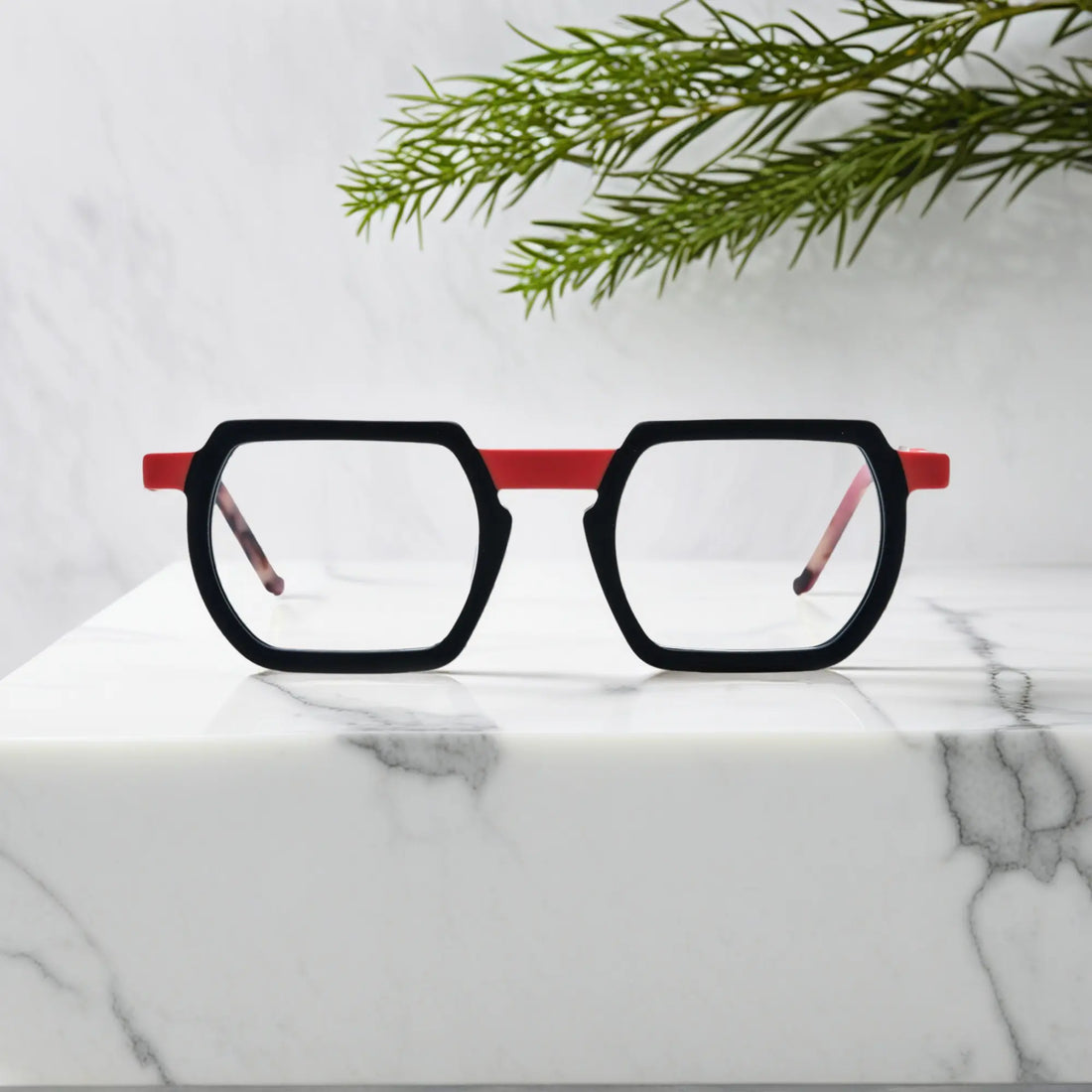 Front angle of VoyueLens™ Crimson Noir square frames in matte black with deep crimson accents