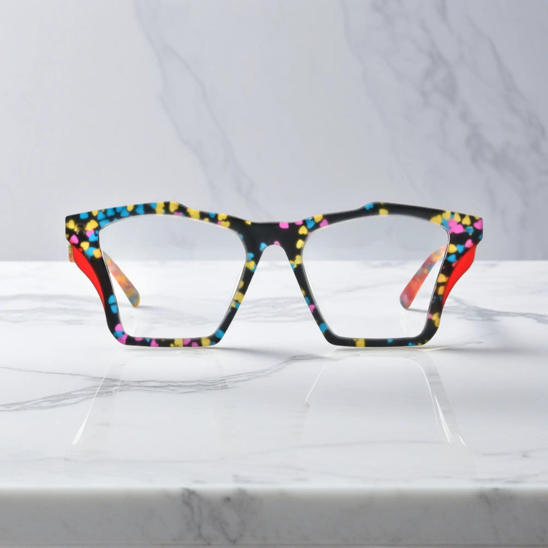 Front-facing view of VoyueLens™ Crystal Confetti butterfly eyeglass frame featuring translucent frosted acetate with pastel speckles, showcasing its signature matte butterfly design.