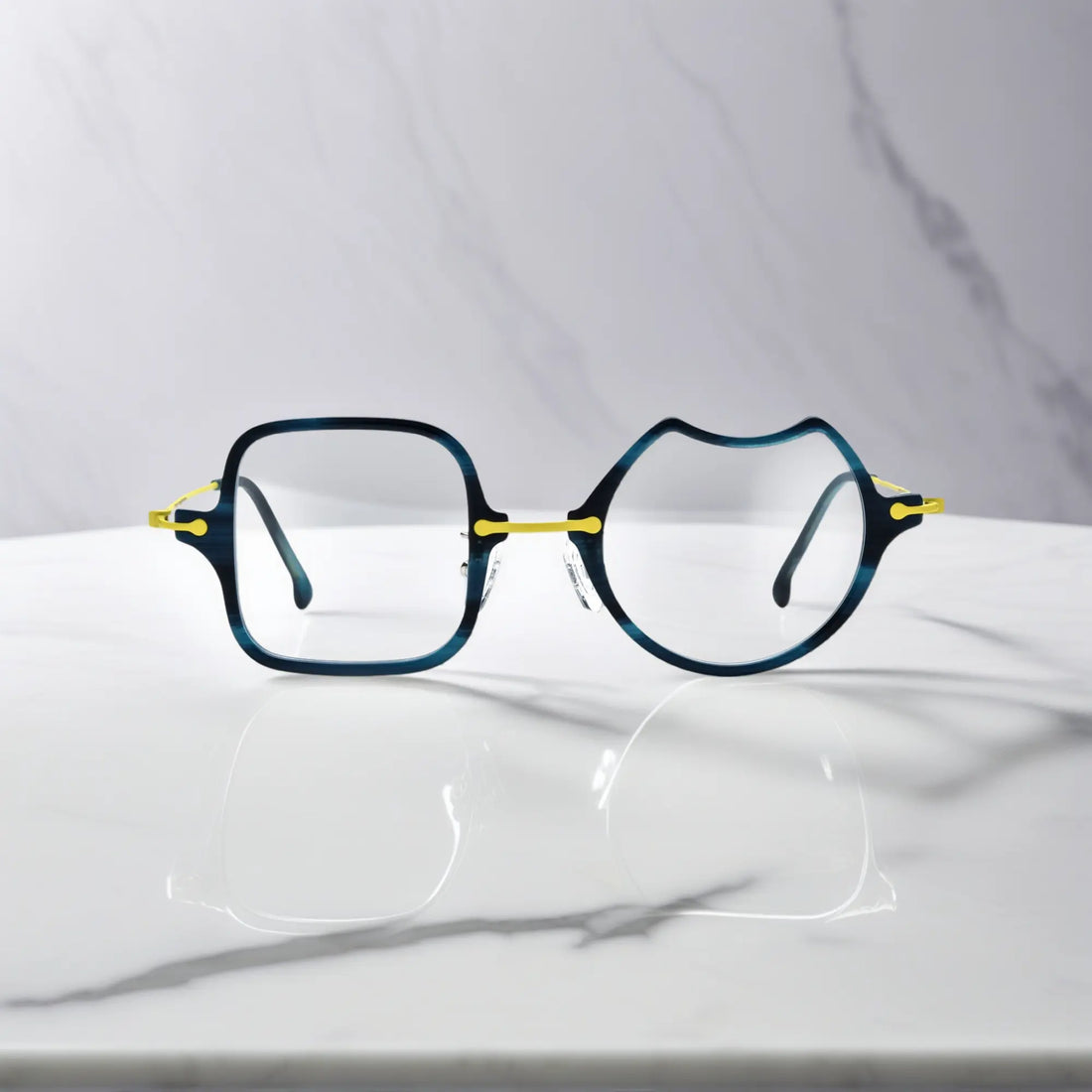 Front View of VoyueLens™ Electric Olive bold abstract eyeglasses VL185842-C5. Close-up of the front-facing design showing the asymmetric lens combination with acetate finish.