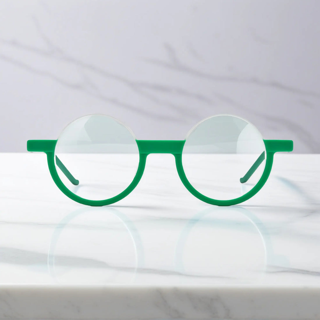 Front view of Emerald Ice VoyueLens™ eyeglasses featuring frosted green-white tones in elegant round styling.