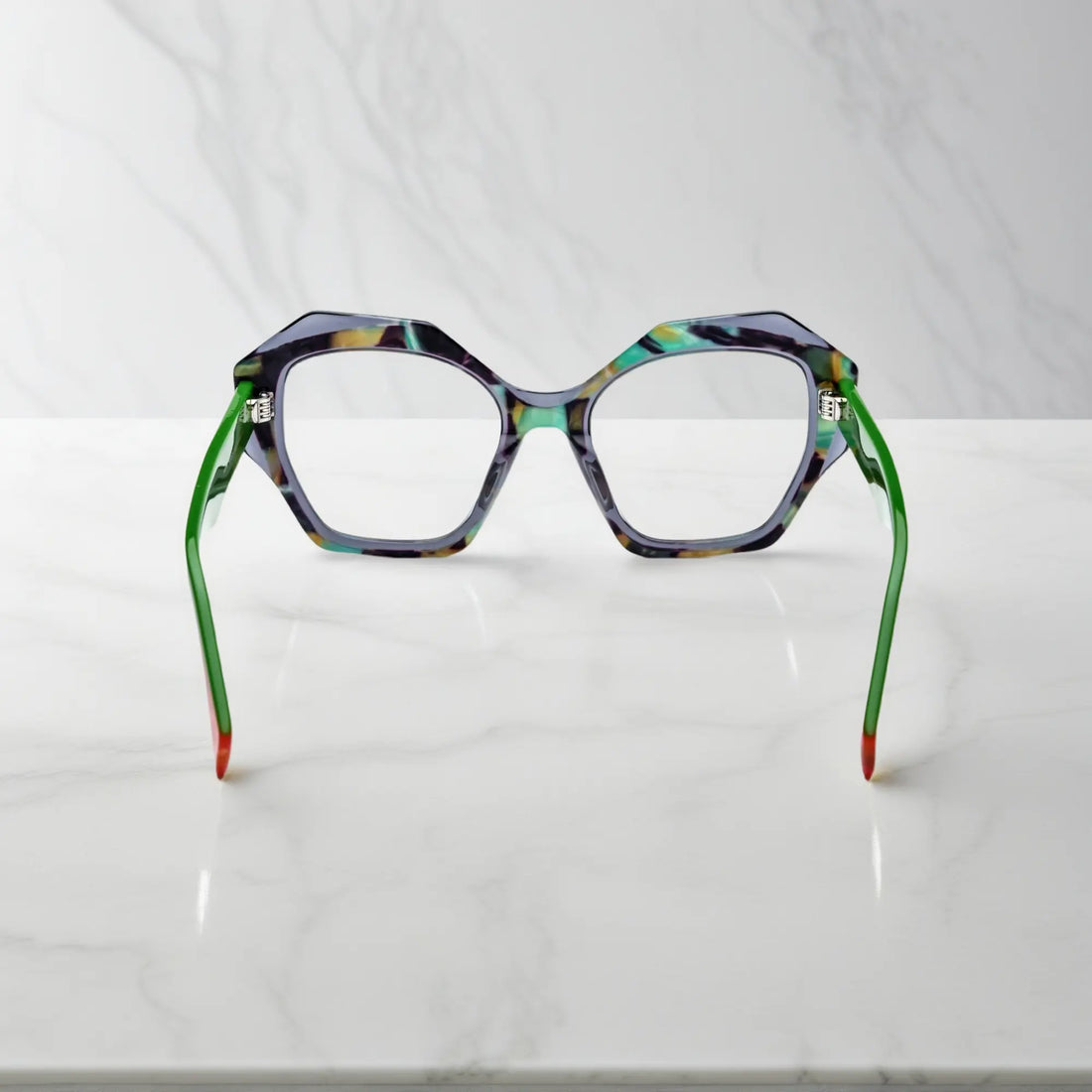 Rear view highlighting color-blocked orange tips and lightweight spring hinge construction.