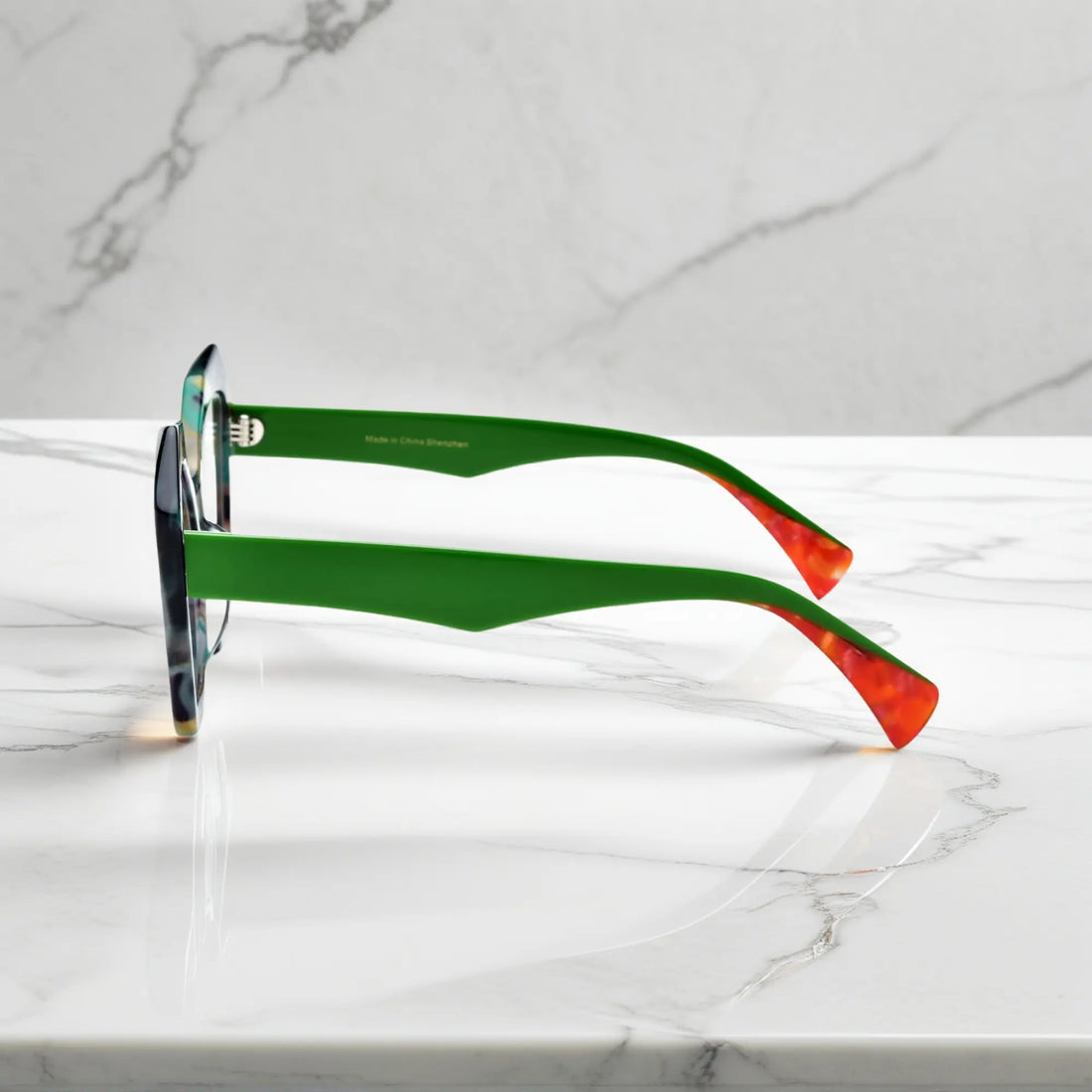 Side angle of Forest Marble polygon glasses with subtle multi-tonal acetate finish.