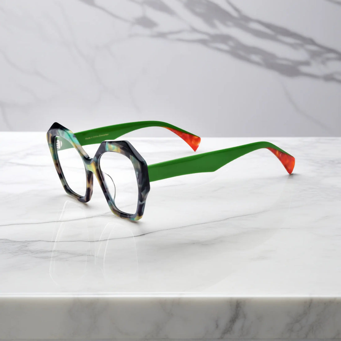 Side profile showcasing the sculpted green temples and bold acetate design of Forest Marble eyeglasses.