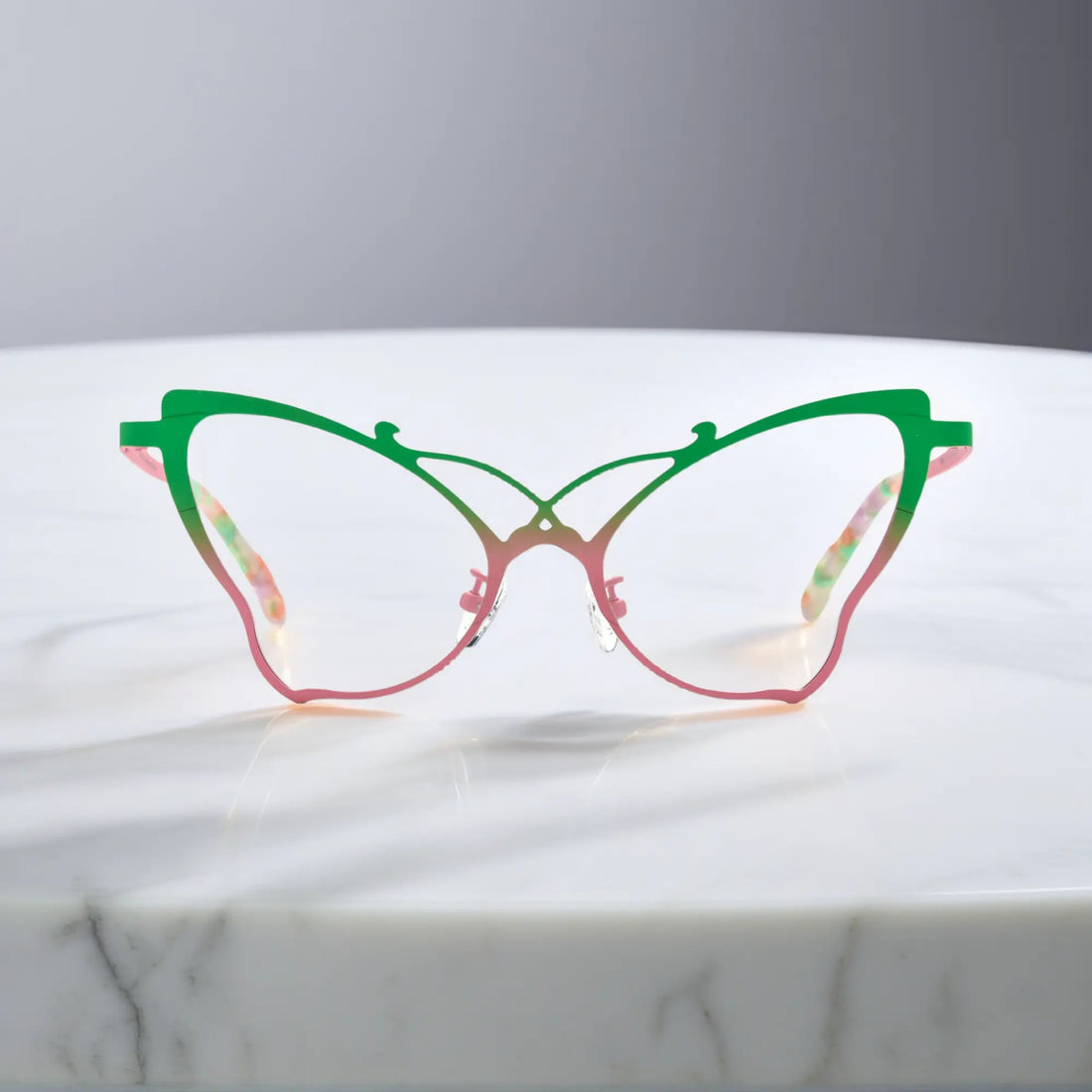 Front of VoyueLens™ VL185862 titanium butterfly eyeglasses in Green Blush – a lightweight, colorful, vintage-inspired, prescription ready frame designed for unique artistic style and everyday comfort.