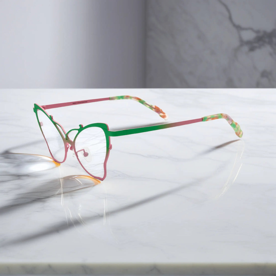 Side of VoyueLens™ VL185862 titanium butterfly eyeglasses in Green Blush – a lightweight, colorful, vintage-inspired, prescription ready frame designed for unique artistic style and everyday comfort.