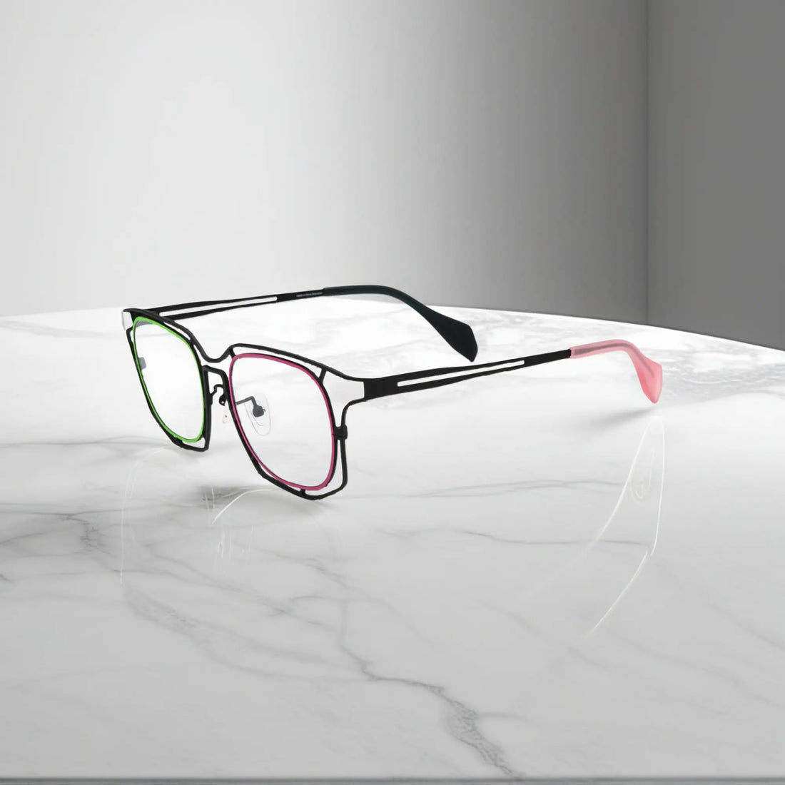 Side view showing pink and green elements of Mint Pink Fusion titanium frame