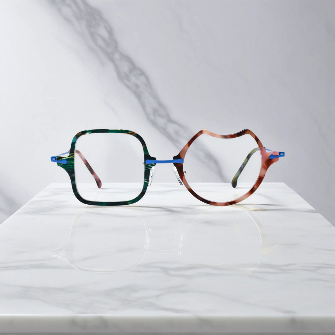 Front View of VoyueLens™ Ocean Brick abstract eyeglasses VL185842. Close-up of the front-facing design showing the asymmetric lens combination with acetate finish.