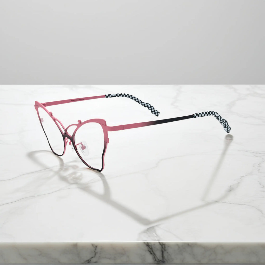 Side of VoyueLens™ VL185862 titanium butterfly eyeglasses in Pink Black – a lightweight, colorful, vintage-inspired, prescription ready frame designed for unique artistic style and everyday comfort.