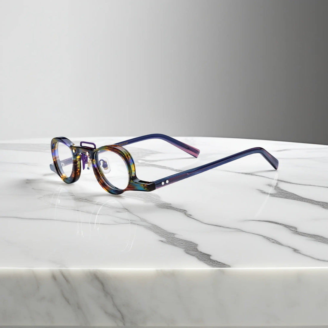 Side profile of VoyueLens™ Rainbow Tortoise geometric eyeglass frames showing temples and nose pads
