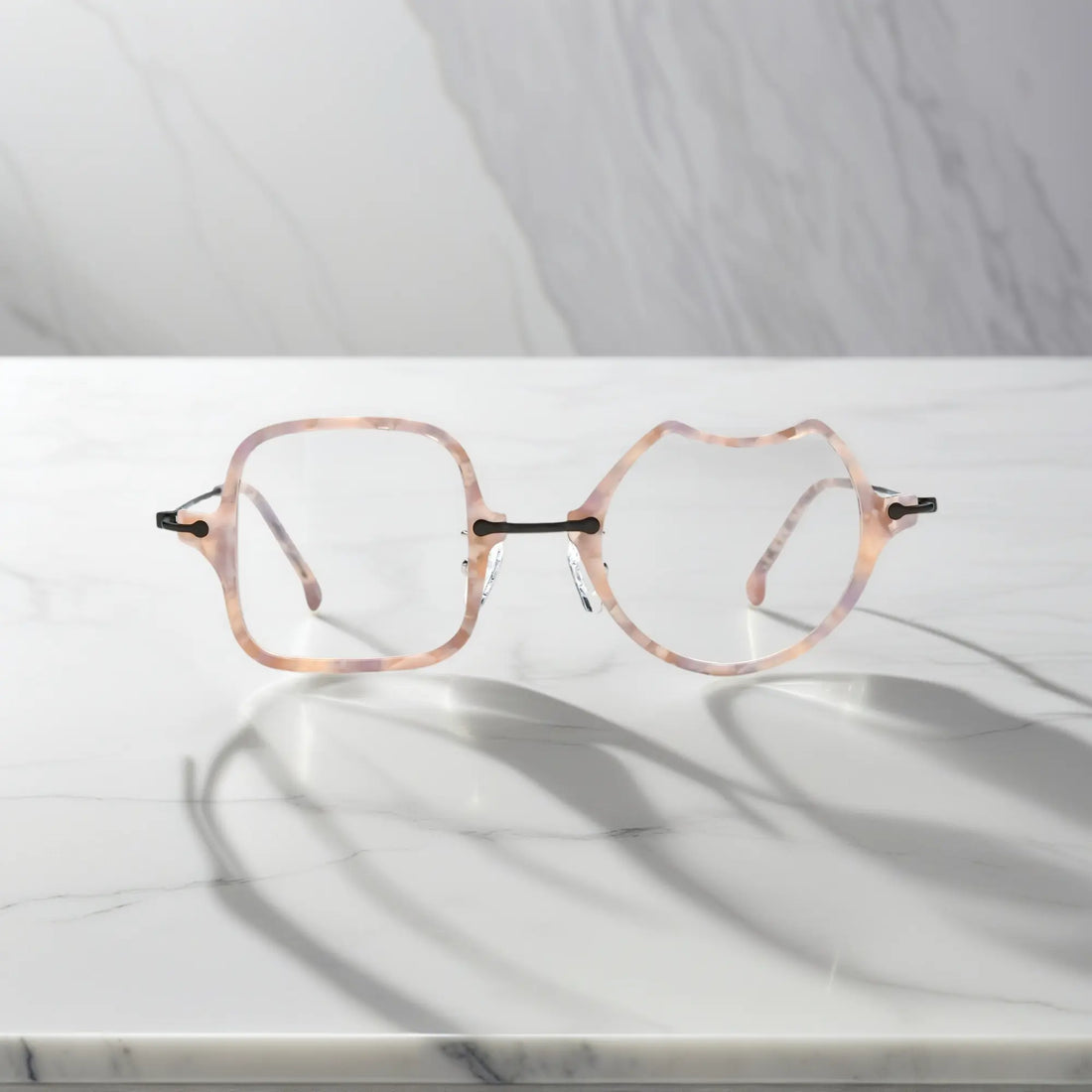 Front View of VoyueLens™ Shell Pink dual-shaped artistic eyeglasses VL185842-C3. Close-up of the front-facing design showing the asymmetric lens combination with acetate finish.