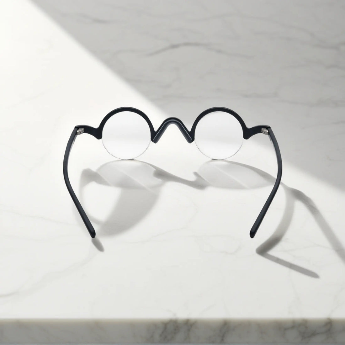 Back view of VoyueLens™ Solid Black semi-rimless browline eyeglasses showing frame and temple construction.