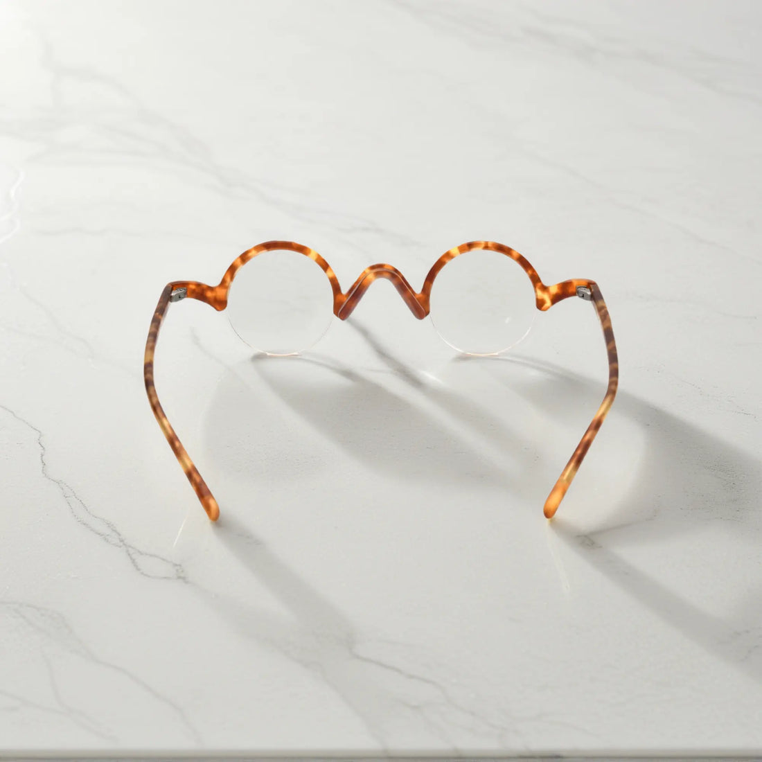 Rear view of VoyueLens™ Tortoiseshell semi-rimless browline eyeglasses emphasizing durable design.