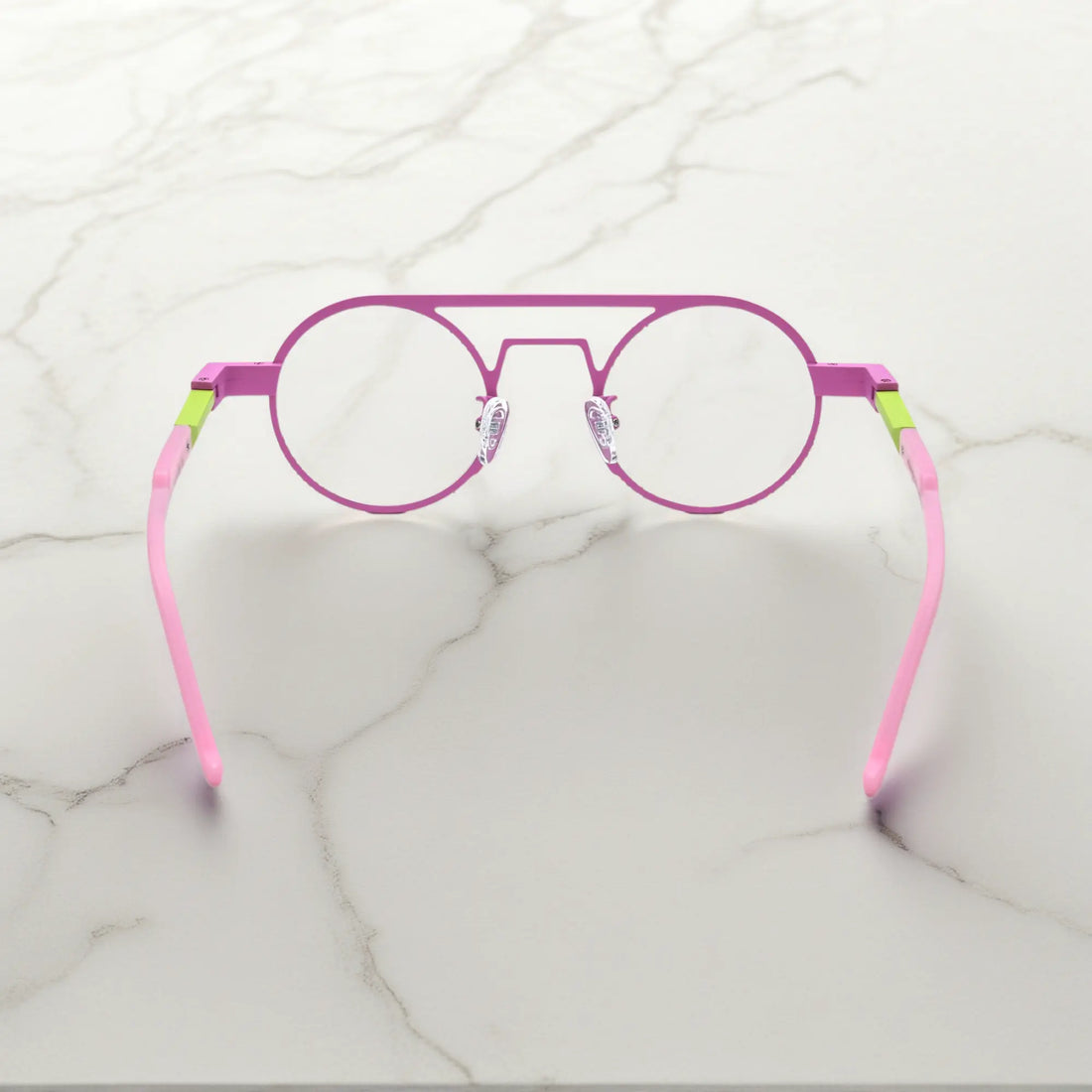 Rear angle displaying the ergonomic nose pads and lightweight design in Candy Lime color-block titanium frame with pink-green tones, part of the NeoPilot series