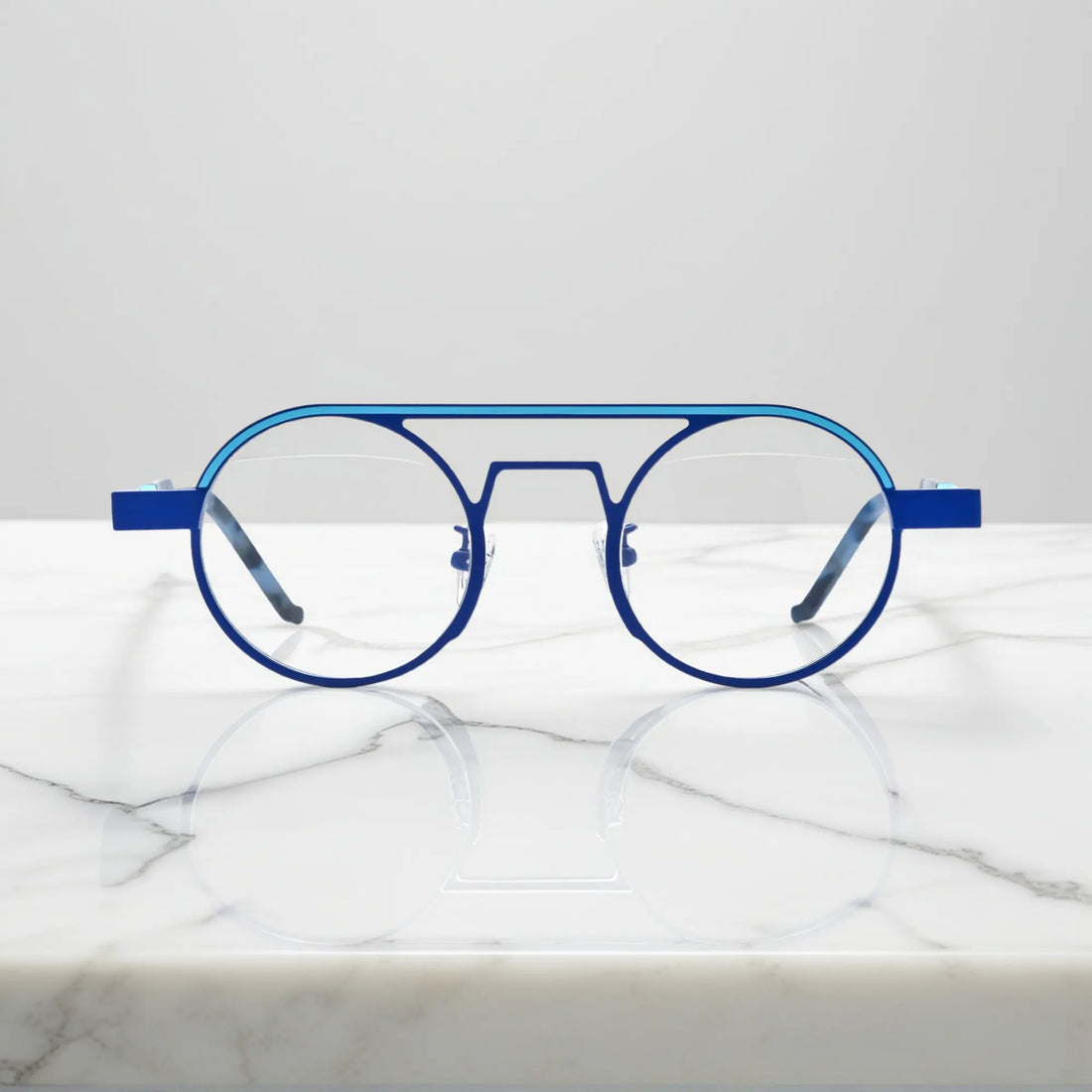 Front view of VoyueLens™ NeoPilot aviator glasses in Glacier Blue icy titanium aviator frame with a cool, futuristic tone