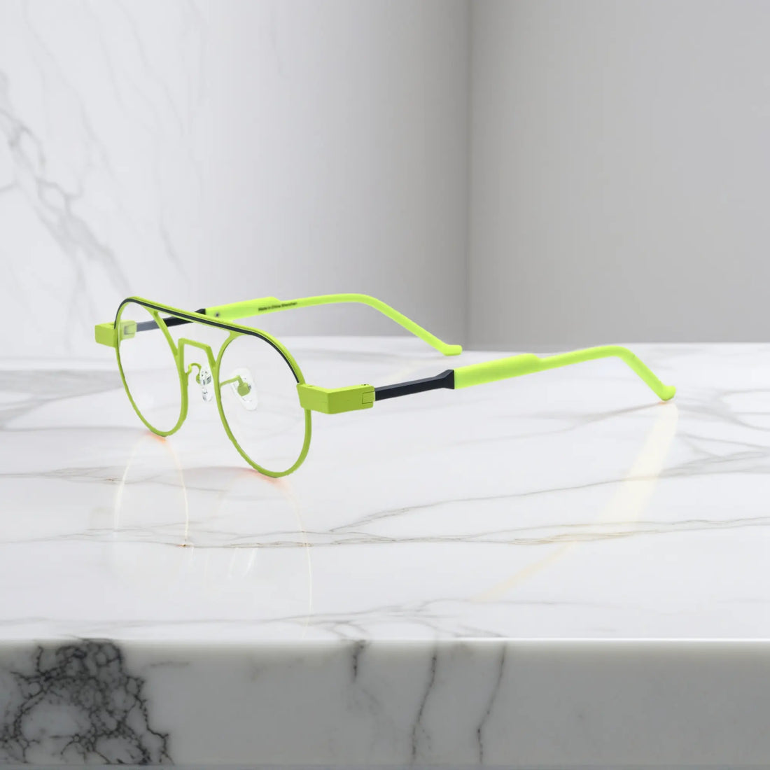 Side profile showing the slim titanium arms and hinge structure in Neon Moss bold green colorway for statement-making eyewear