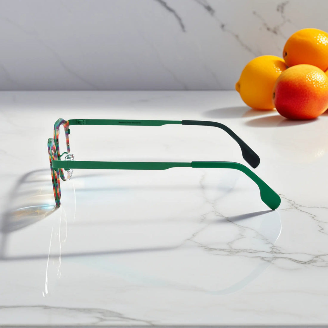 Side view of VoyueLens™ Aurora Stripe square eyeglasses a green-to-clear gradient acetate front and satin titanium temples.