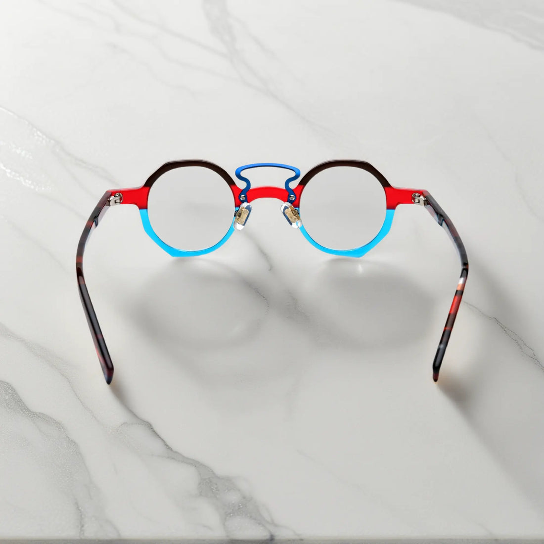 Angled close-up showing geometric shape of VoyueLens™ VL19244 Crimson Blue Fusion eyeglasses, ideal for small faces