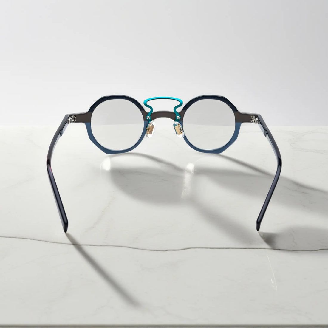 Angled perspective showing VoyueLens™ VL19244 Forest Grey Mist lightweight geometric eyeglasses
