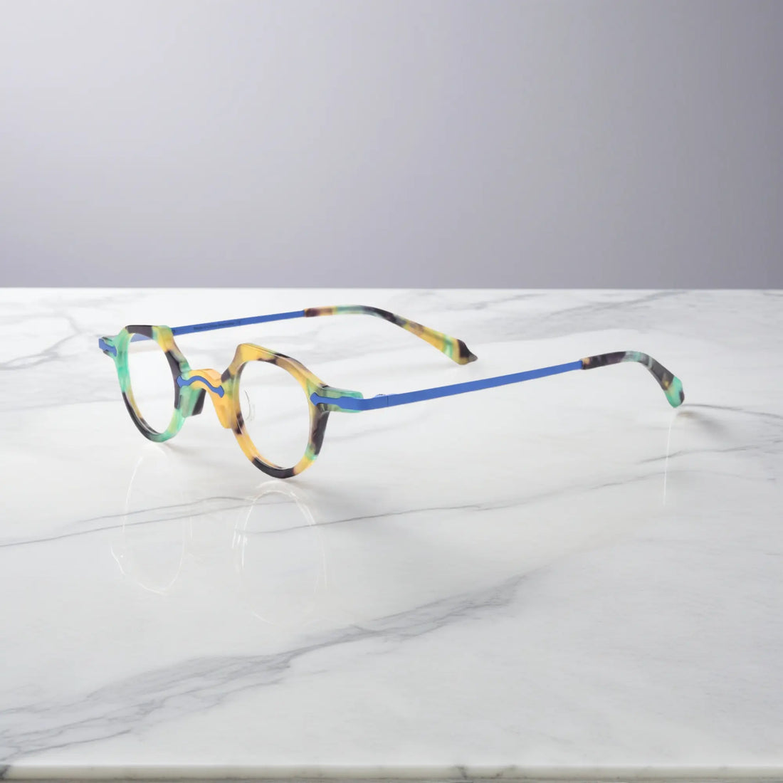 Angled side shot of the VL19341 cobalt blue frame showing ultra-lightweight metal temples and elegant frame curvature for daily comfort.