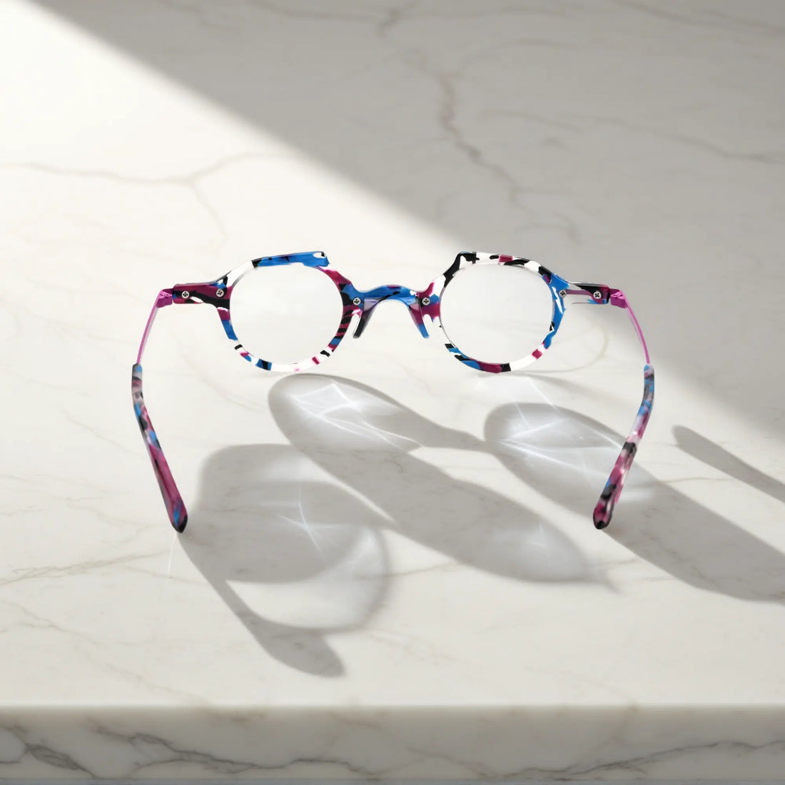 Rear view highlighting the design symmetry of the orchid purple acetate frame and sleek metallic temple construction.