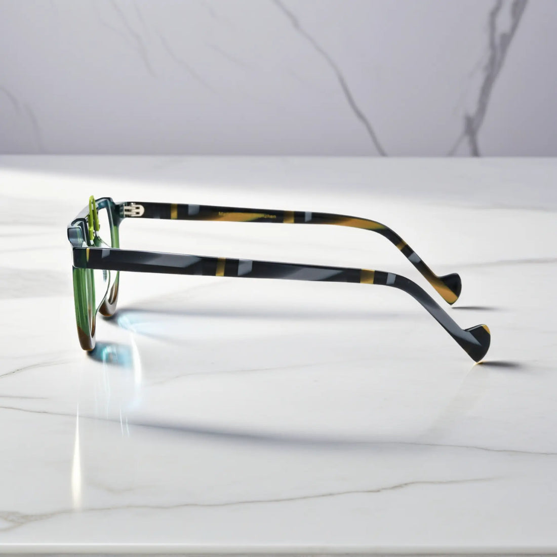 Side profile showing the bold acetate structure of the Lime Tortoiseshell round glasses and temples