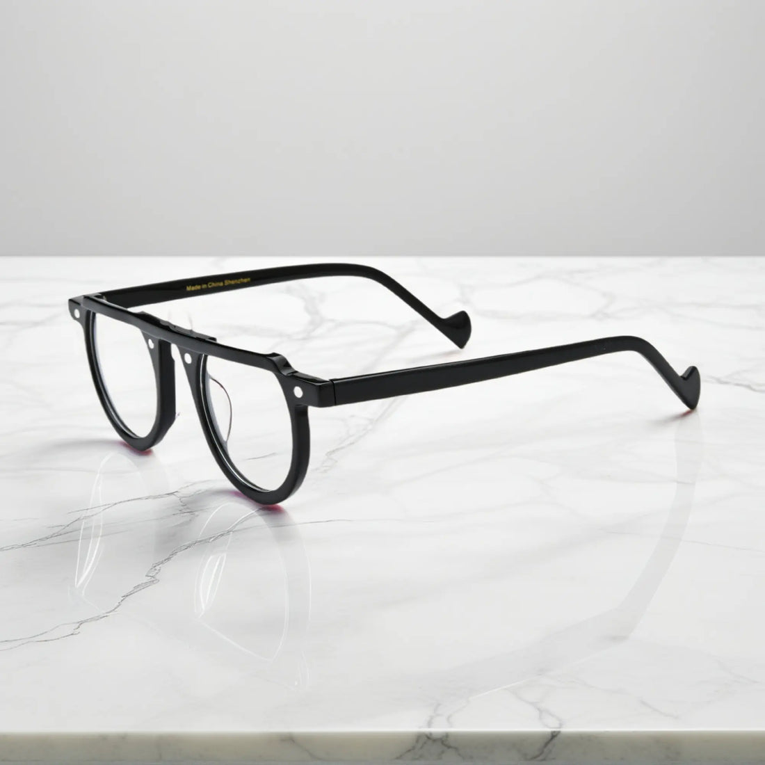 Sleek side profile of Charcoal Black round acetate glasses from VoyueLens™