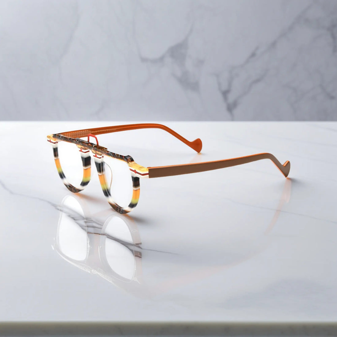 Side profile of VL19383 round glasses in striped amber acetate