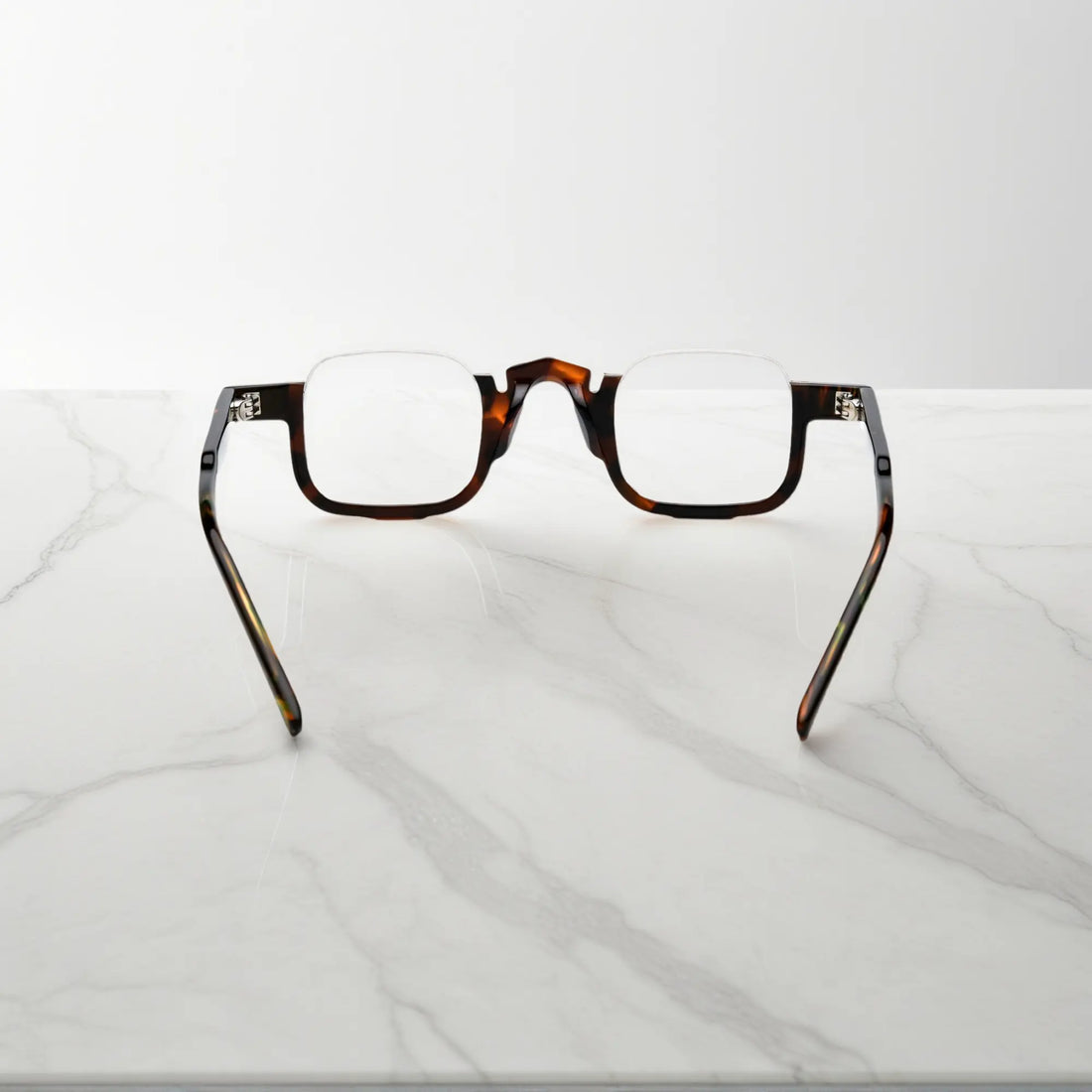 Back view of VoyueLens™ acetate eyeglasses in warm tortoise color, lightweight square prescription-ready frame