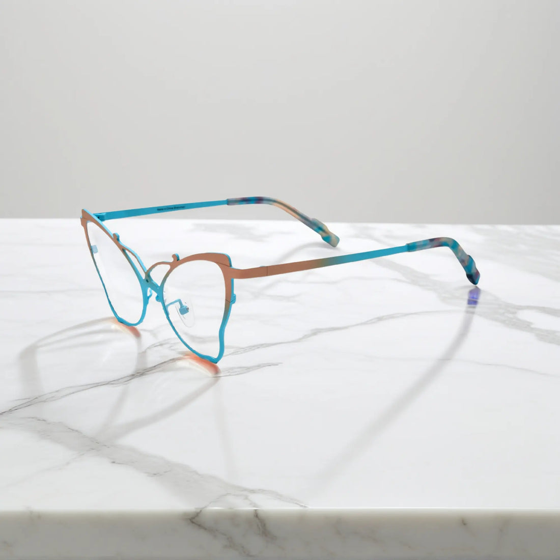 Side of VoyueLens™ VL185862 titanium butterfly eyeglasses in Yellow Blue – a lightweight, colorful, vintage-inspired, prescription ready frame designed for unique artistic style and everyday comfort.