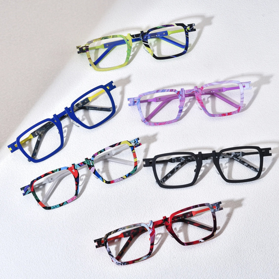 Barledear geometric square titanium eyeglasses collection group image showing Lime Cobalt Mosaic, Cobalt Lemon Mosaic, Lavender Rose Mosaic, Confetti White Mosaic, Onyx Smoke Marble, and Crimson Noir Mosaic color variants