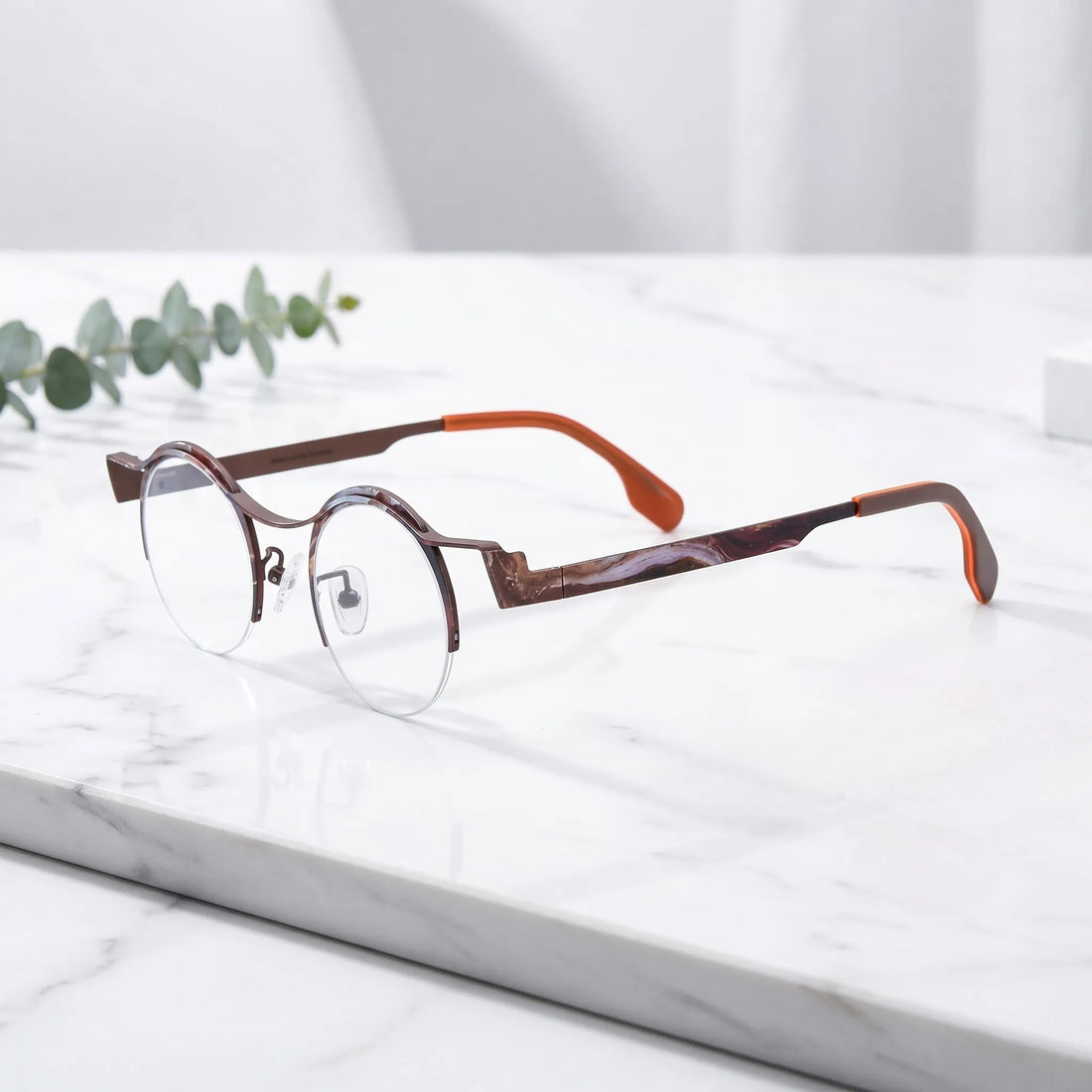 Barledear Amber Cocoa eyeglasses angled side view showing brown temple details, round lenses, and semi-rimless pure titanium frame