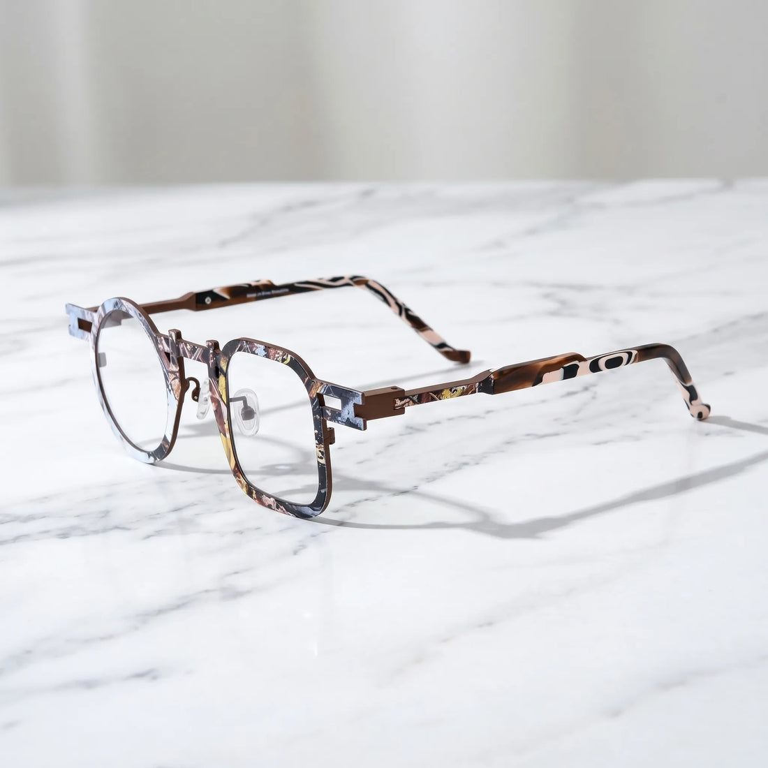 Barledear Amber Mosaic Brown eyeglasses angled side view showing slim temples, extended side-bar detail, and adjustable nose pads