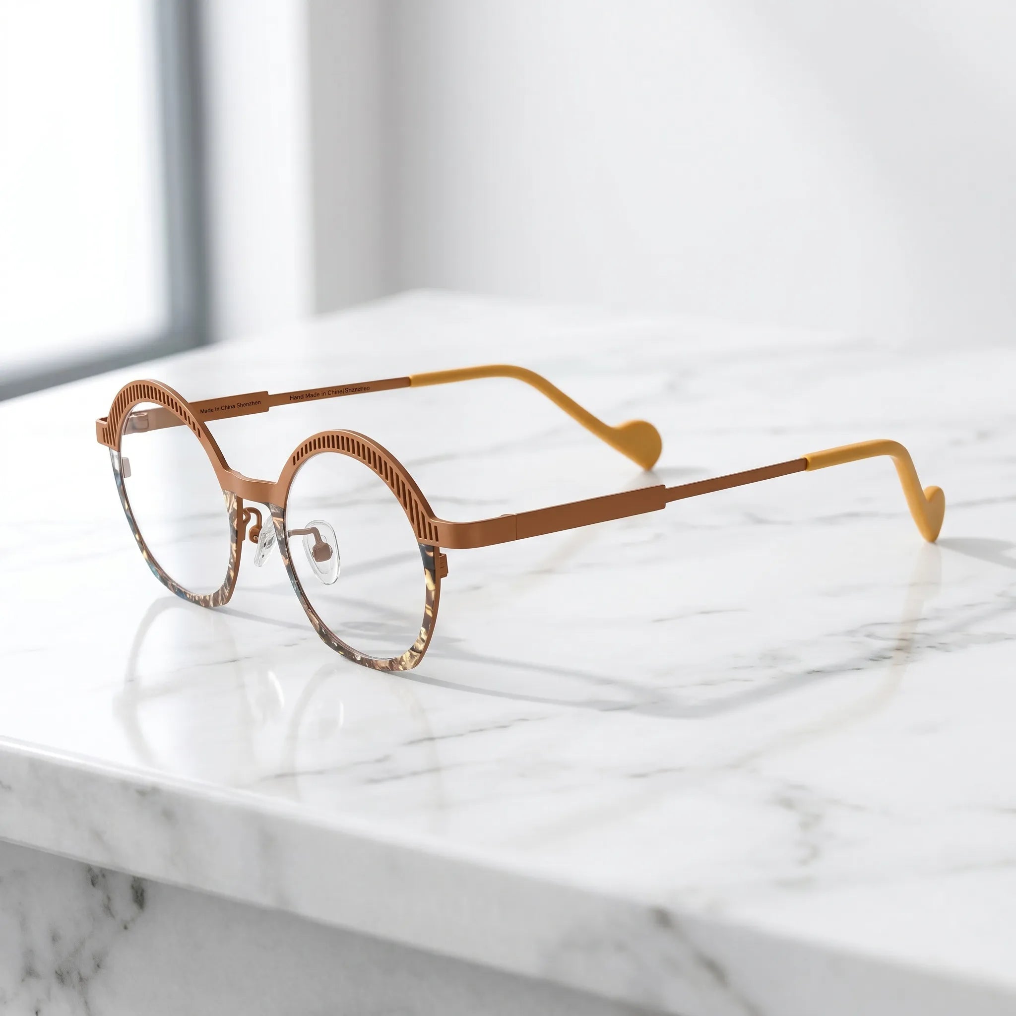 Barledear Amber Mosaic eyeglasses angled side view showing slim temples, clear nose pads, and sculpted slotted browline detail