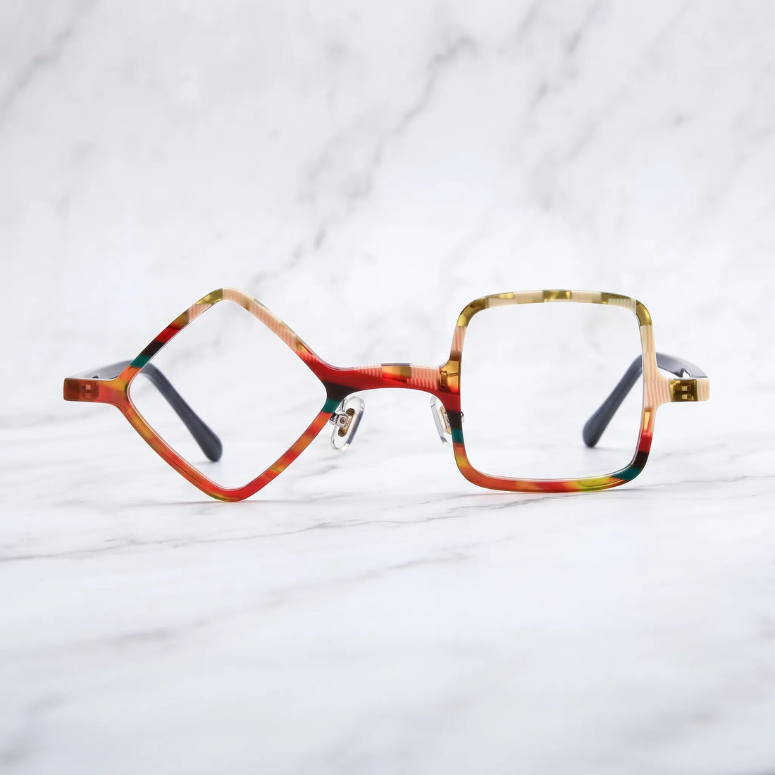 Barledear Amber Mosaic asymmetric geometric acetate eyeglasses shown in a clean lifestyle front display with warm multicolor acetate patterns.
