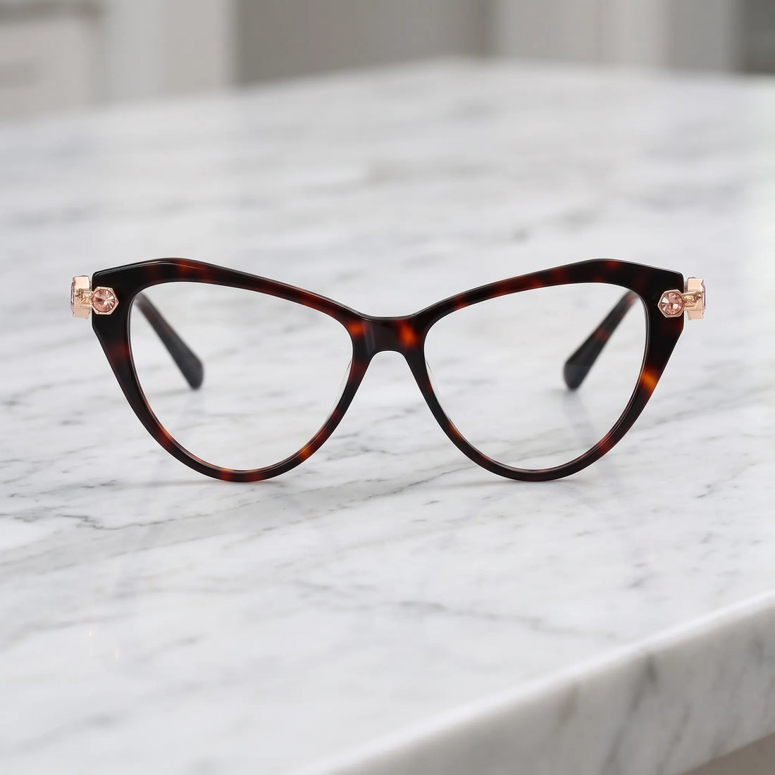 Barledear Amber Tortoise cat-eye eyeglasses shown in a warm lifestyle front display with multicolor crystal-accent temples