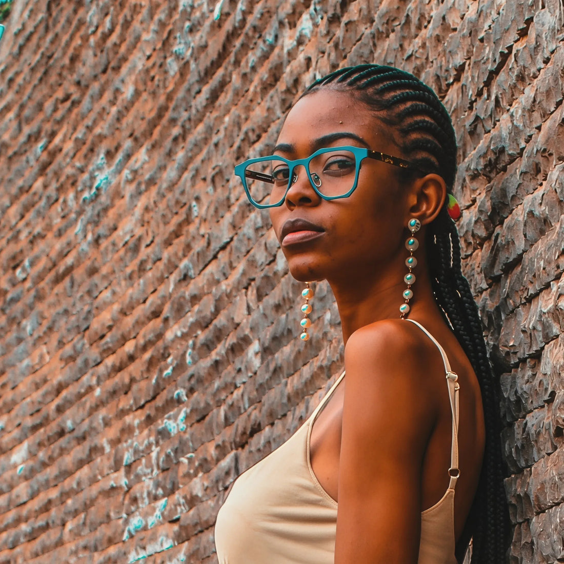 Model wearing Barledear Aqua Tortoise eyeglasses with modern geometric square titanium frame in a lifestyle portrait