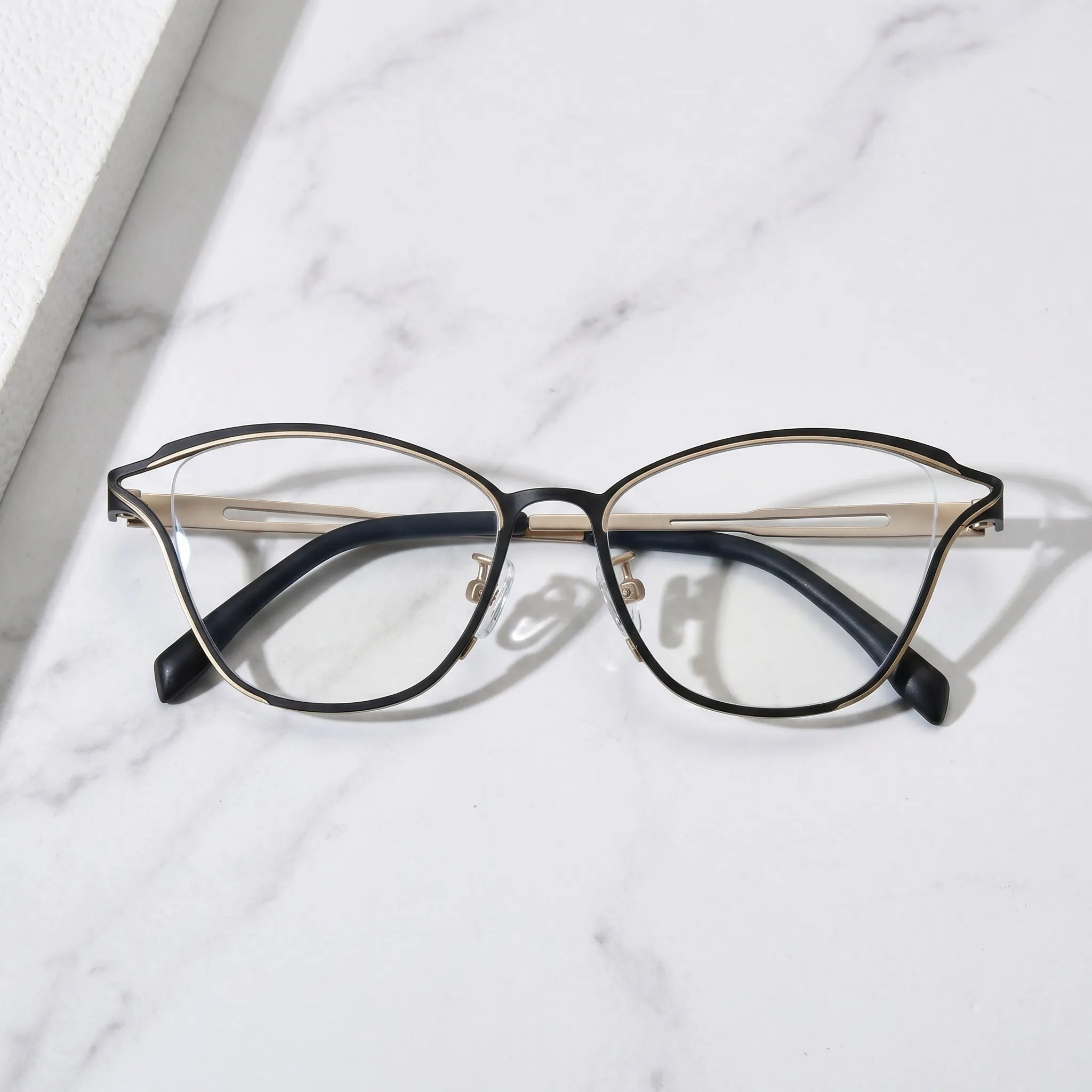 Barledear Champagne Noir eyeglasses folded display showing slim titanium frame and black temple design