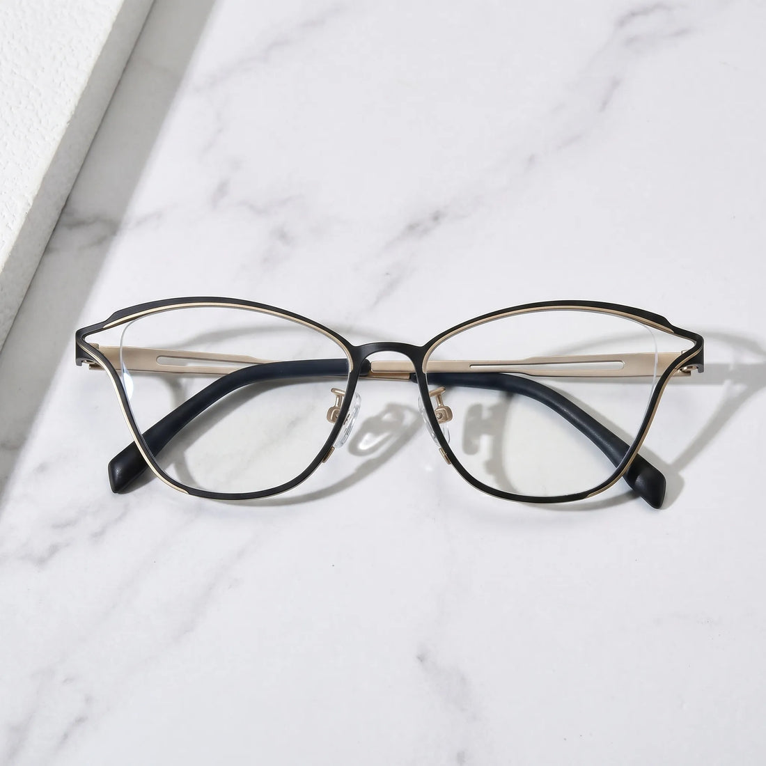Barledear Champagne Noir eyeglasses folded display showing slim titanium frame and black temple design