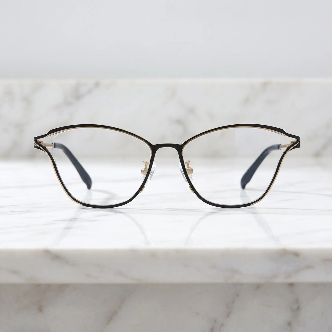 Barledear Champagne Noir eyeglasses shown in a clean lifestyle front view with black and champagne titanium frame detail