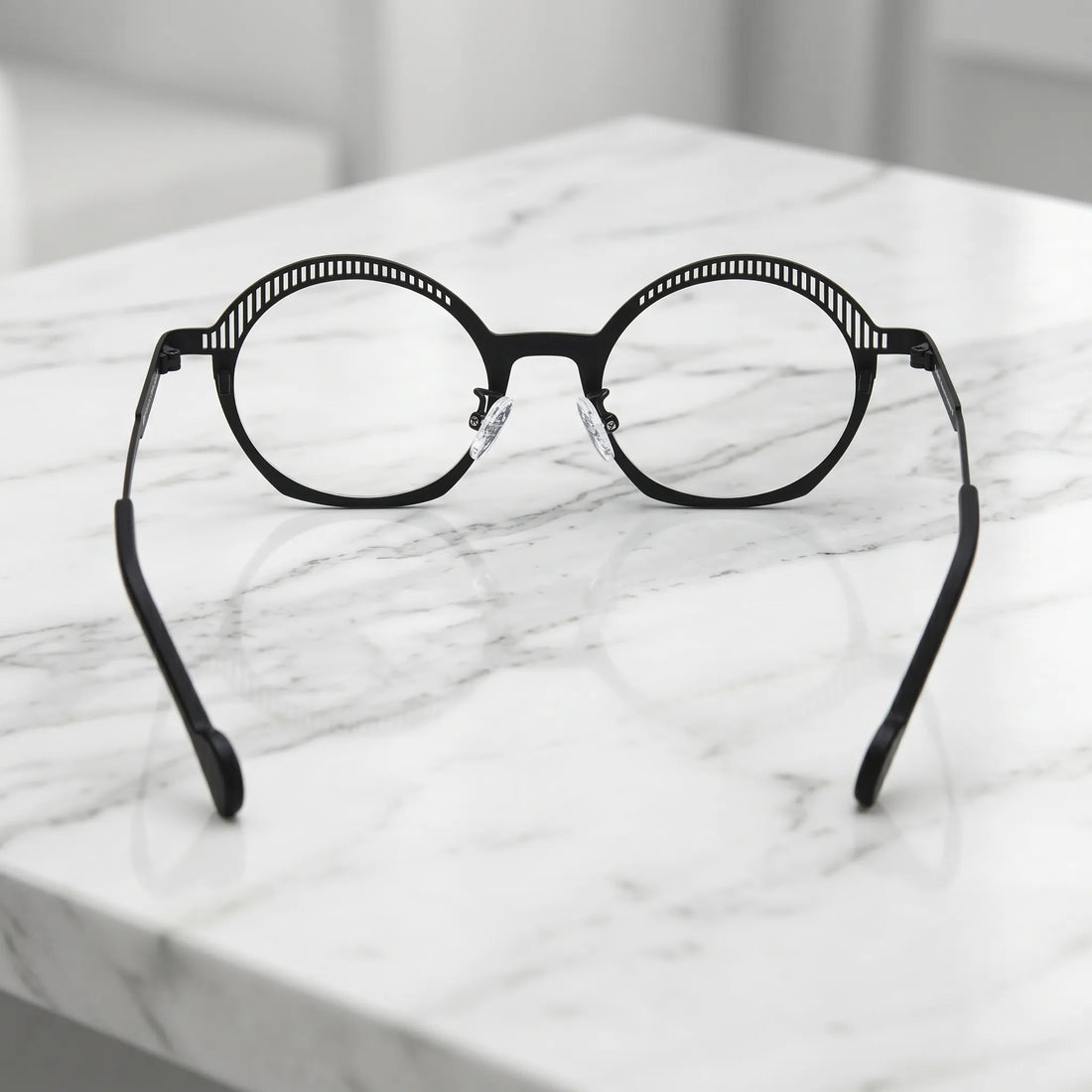 Barledear Charcoal Black eyeglasses back view showing adjustable clear silicone nose pads and prescription-ready titanium frame structure