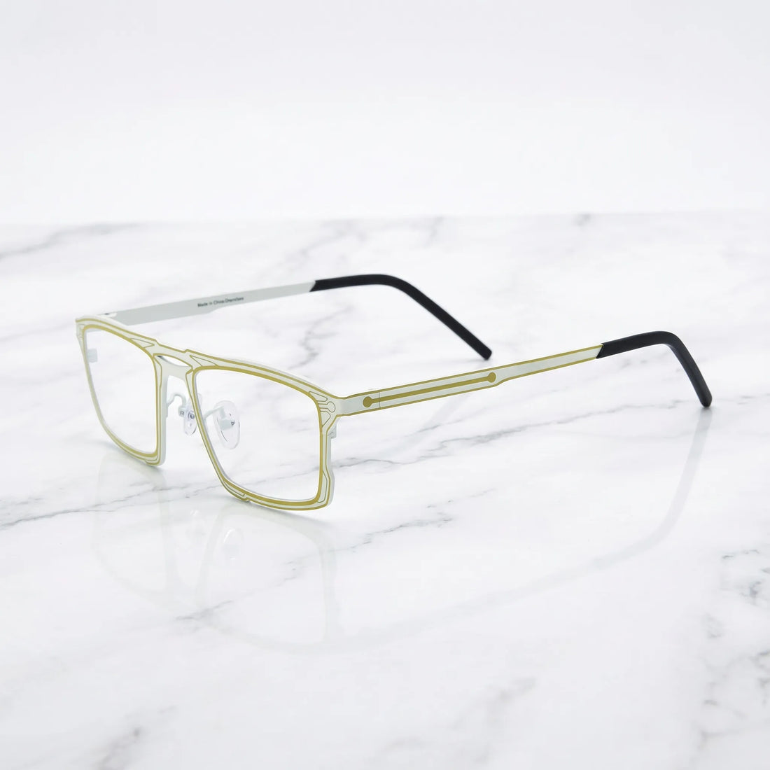 Barledear Citrus Ivory eyeglasses angled side view showing slim dual-tone temples, bridge detail, and adjustable nose pads