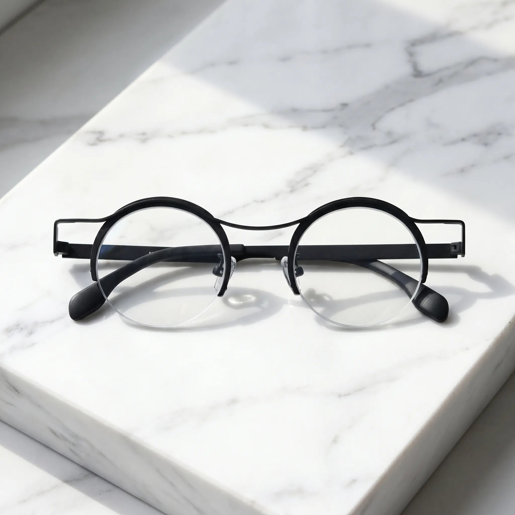 Barledear Classic Noir eyeglasses folded display showing slim black titanium temples and lightweight frame structure